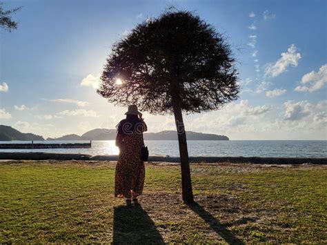 A Woman Looking Over Sunset In Cenang Beach Langkawi Island Kedah
