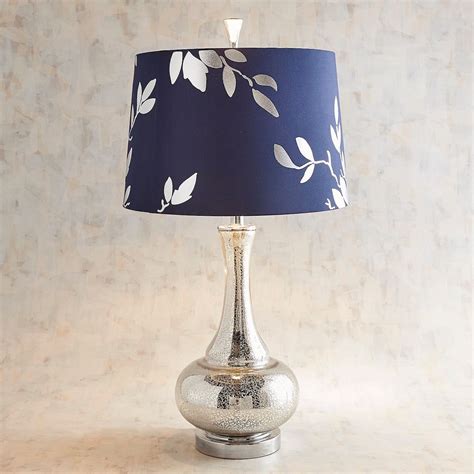 This series of wooden desk lamps is inspired by the metamorphosis produced by nature and the intrinsic beauty of each moment of its mutability. Navy & Silver Leaf Glass Table Lamp | Silver lamp, Table ...