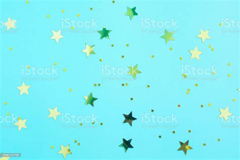 Gold Glitter Stars Decorations On Blue Background Stock Photo