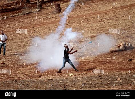West Bank Nablus Palestine 29th Oct 2021 A Palestinian Demonstrator Throws Back Tear Gas