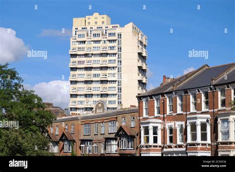 Red Brick Early 20th Century Housing Against The Backdrop Of Mid 20th