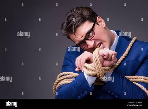 Businessman Tied Up With Rope Stock Photo Alamy
