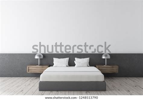 minimalistisches schlafzimmer mit weissen und grauen waenden holzboden