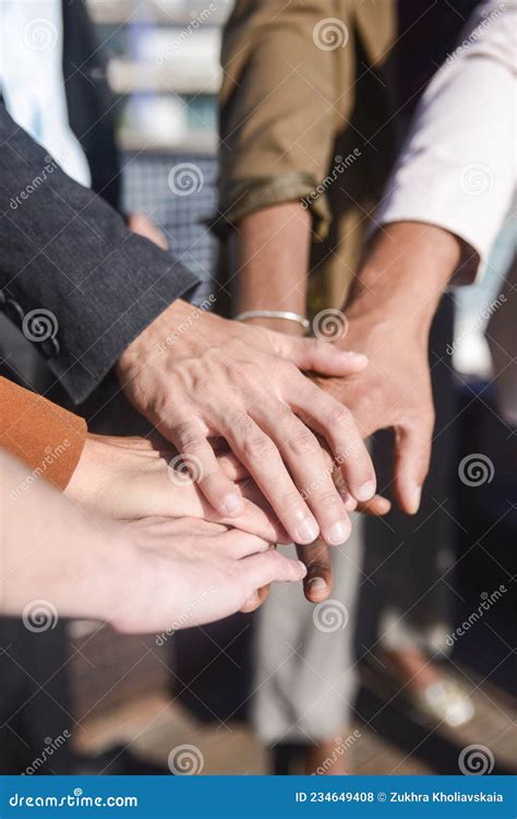 Close Up Of Business People Putting Hands Together Stock Photo Image