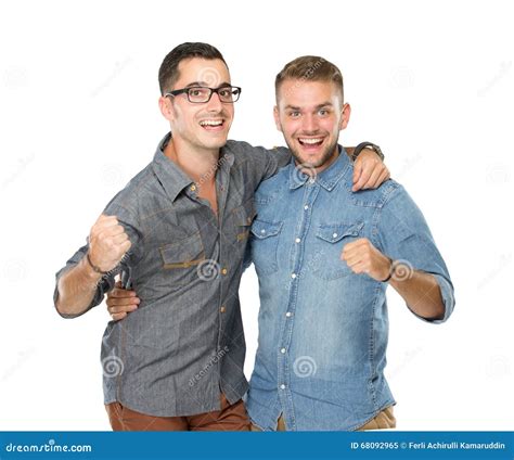 Two Friends Guys Standing With Hands On Shoulders And Looking At Stock