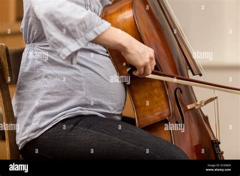 Pregnant Woman Playing The Cello Stock Photo Alamy