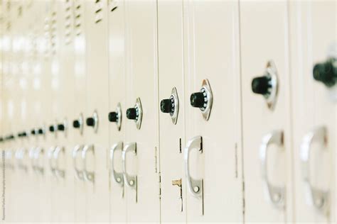 Row Of School Lockers In Hallway With Combination Lock By Stocksy