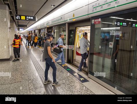 Hong Kong Mtr Passengers Getting On A Train At A Mass Transit Railway