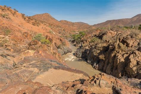 Landscape View Of The Kunene River The Border River Between Namibia