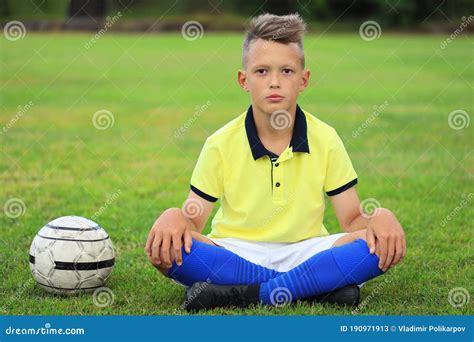 Boy Soccer Player Sitting On The Soccer Field Stock Image Image Of
