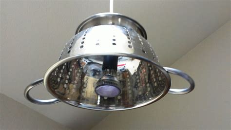 These can lights create pools of light around the kitchen while the blue lights create an interesting visual when viewed against the burgundy color scheme of the rest of the room. My homemade overhead kitchen light. Colander meets halogen ...
