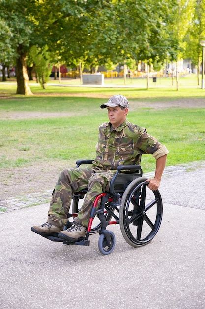 Free Photo Focused Disabled Military Man In Wheelchair Wearing