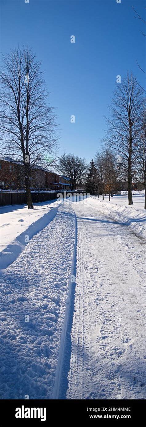 Panoramic Vertical Photo Of The Footpath With Deep Snow For A Winter