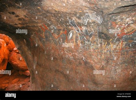 Sunlight Enters A Cave With Aboriginal Cave Paintings At The Bottom Of