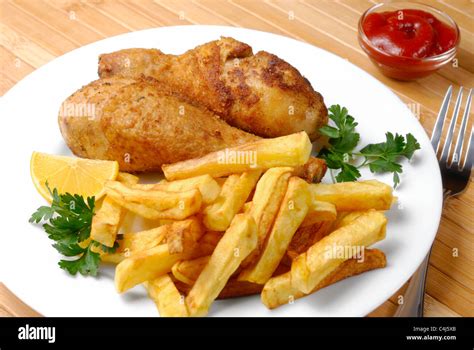 Fried Chicken Legs And Potato Chips Stock Photo Alamy