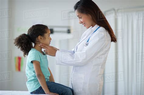Usa New Jersey Jersey City Female Pediatrician Examining Girl 6 7 In Doctors Office