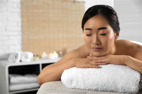 Beautiful Asian Woman Lying On Massage Table In Spa Salon Stock Photo Image Of Relax Happy