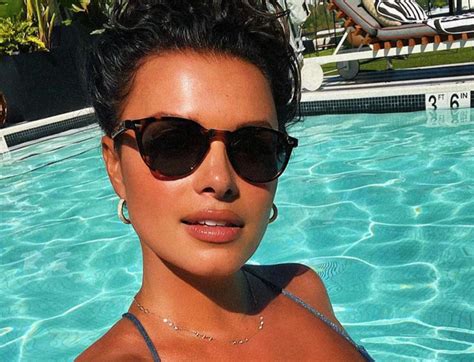 fs1 s joy taylor flaunts her oiled up body in a tiny bikini while in a pool blacksportsonline