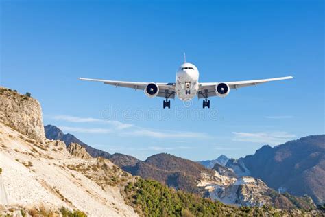 Mountain Landscape And Landing Passenger Aircraft Travel To The