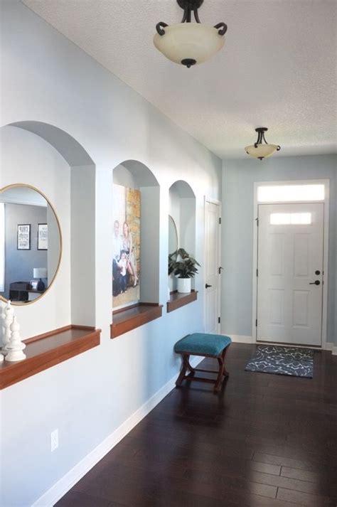 Niches In The Entry Hallway Add Visual Interest And Provide Ledges To
