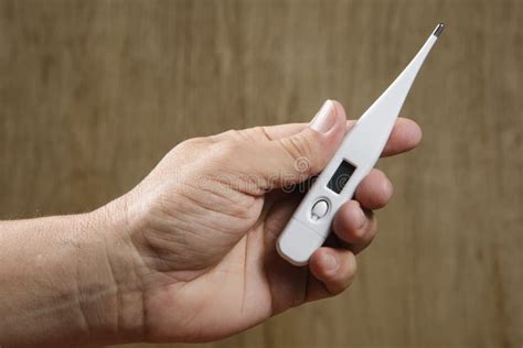 Hand Holding Digital Thermometer Stock Photo Image Of Digital