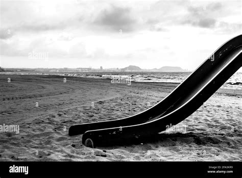 Abstract Structures Of Swings On The Beach In Spain In Black And White