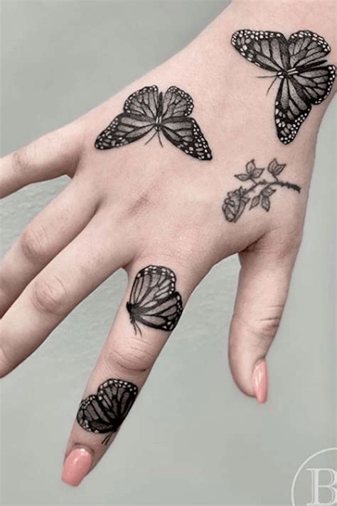 This monarch butterfly tattoo is a solid black piece and looks great on the upper thigh is a great alternative to the cliche bows that everyone seems to have these days. 21 Simple and Beautiful Butterfly Tattoos Mainly for Your Fingers, Backs and Arms