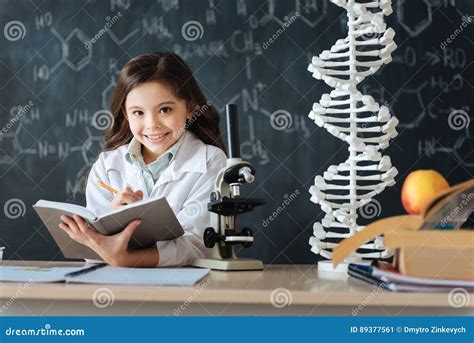 Smiling Young Researcher Studying Science In The Laboratory Stock Image