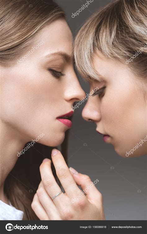 Lesbian Couple Kissing With Eyes Closed Stock Photo By Dimabaranow