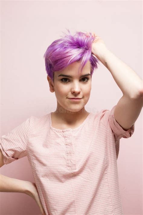 Violet Short Haired Woman In Pink Pastelholding Her Hair With O Stock