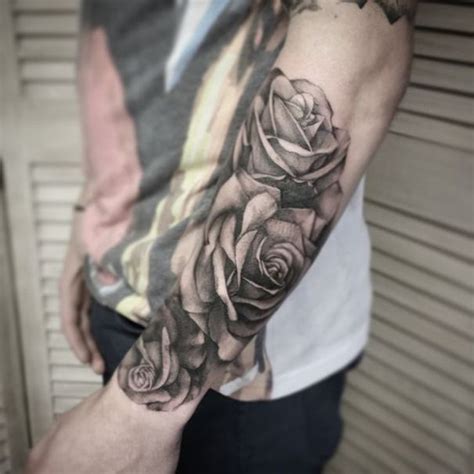 A person who wants to pay tribute to multiple loved ones may have a set of red roses, each representing an individual. rose Tattoo for Men