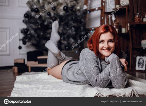 Woman Lying Beside Christmas Tree Stock Photo By Selenittt