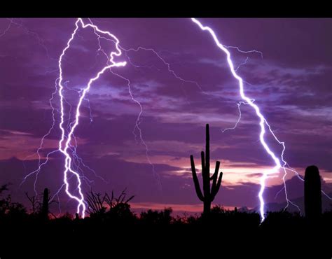 Lightning Strikes A Purple Sky Over The Arizona Desert