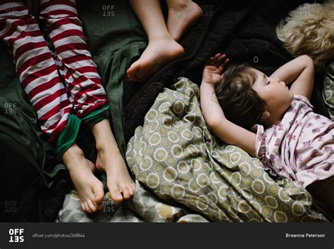 Children Sleeping Together On Bed Stock Photo Offset