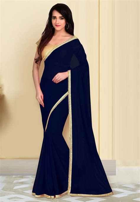 Faux Georgette Saree In Navy Blue Gracefully Enhanced With Beaded Lace And Patch Border Work