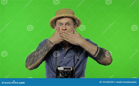 Portrait Of Young Man Tourist Photographer Looking Shocked Chroma Key