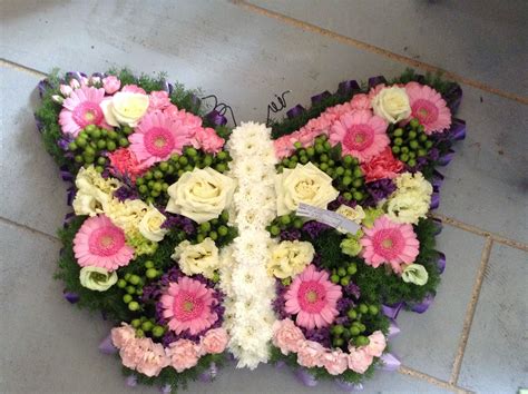 Sending flowers online for every occasion. Funeral Flowers. pink butterfly funeral flower tribute ...
