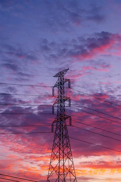 High Voltage Electricity Pylon Pole With Sky And Cloud Colorful Sunset