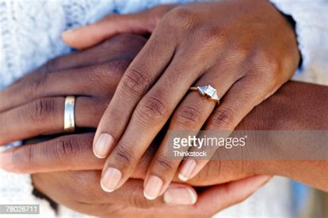 Hands Of Married Couple Wearing Wedding Rings Photo Getty Images
