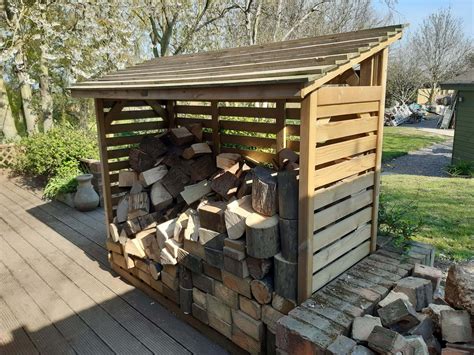 Roofed Log Store Outdoor Log Storage Jacksons Fencing