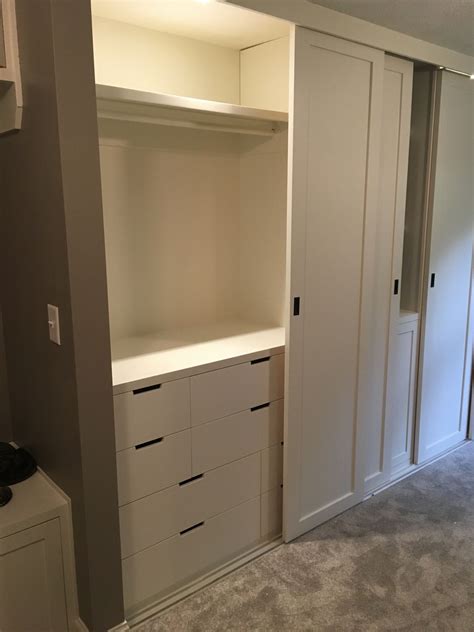 This versatile wardrobe may be placed against a wall, at the end of your bed or as a room divider. IKEA Nordli dressers within built-in closet, sliding ...