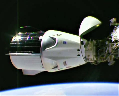 Spacexs Crew Dragon Spaceship Links Up With Space Station For First Time