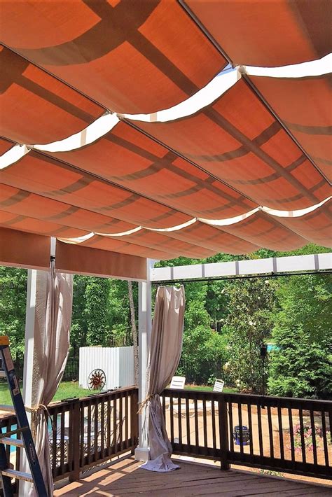 Deck With Overhead Fabric Retractable Shades On Slide Wire Patio
