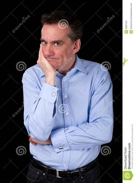 Angry Frowning Man Glaring Over Hand On Chin Royalty Free Stock Image