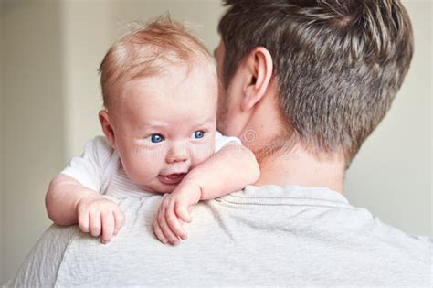 Happy Father Holding Newborn Baby In His Arms Stock Photo Image Of