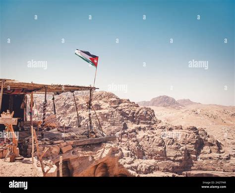 Jordanian Flag Waving In The Wind At A Viewpoint In The Ancient City Of