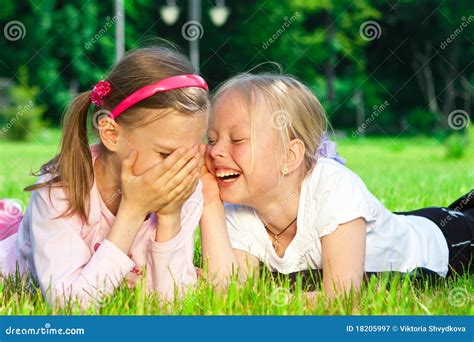 Two Cute Girls Laughing On The Grass Stock Image Image Of Enjoyment Grass 18205997