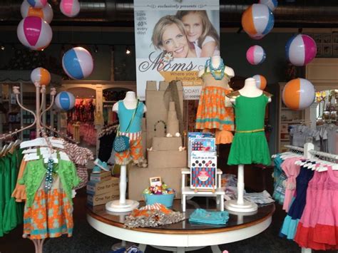 oopsie daisy boutique summer 2013 table display beach balls and sand castle boutique