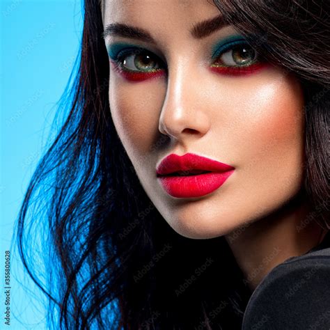 Portrait Of Beautiful Young Woman With Bright Blue Makeup Beautiful Brunette With Bright Red