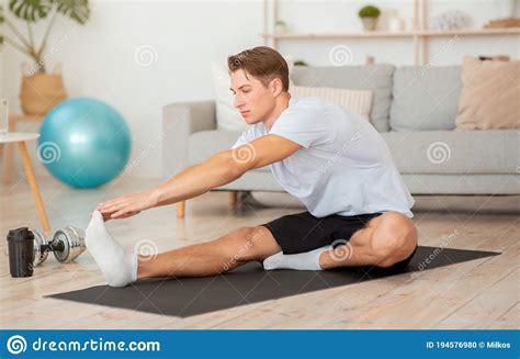Free Time And Exercise At Home During Quarantine Muscular Man Doing